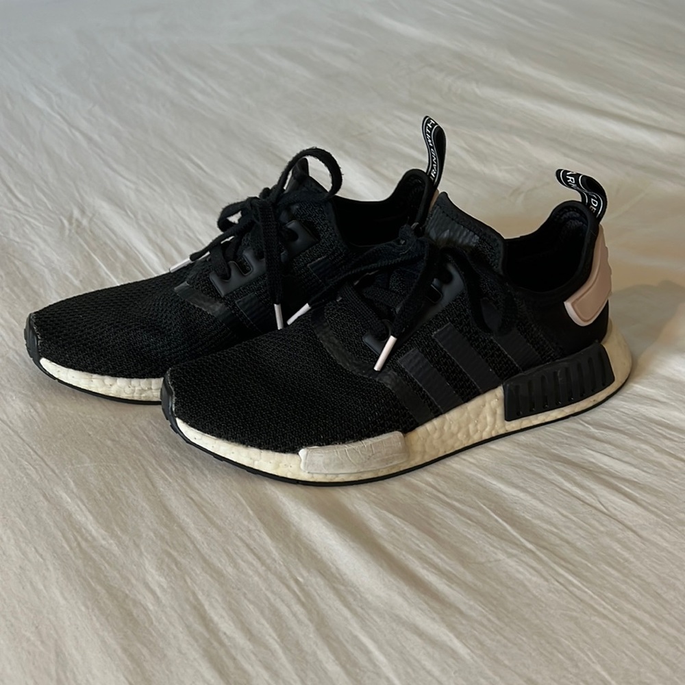Black women’s Adidas NMD sneakers